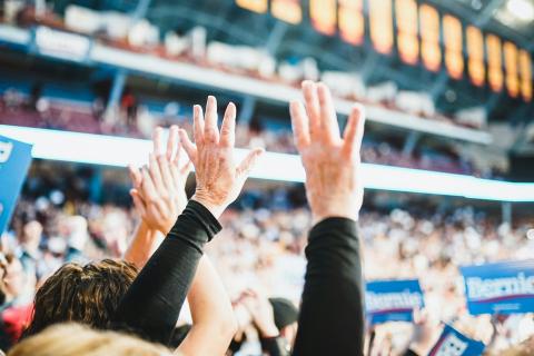 Hands raised at a Bernie rally. 